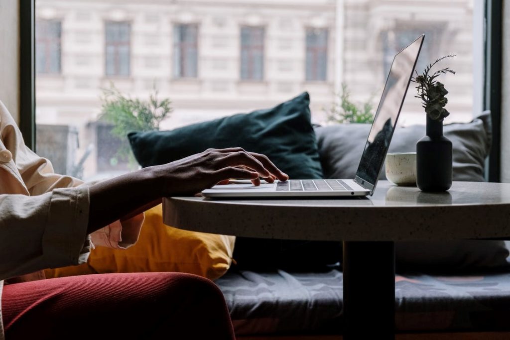 A person typing on laptop