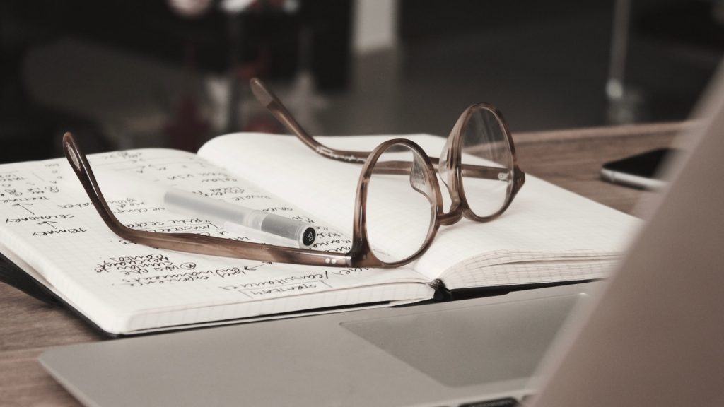 Glasses on notebook