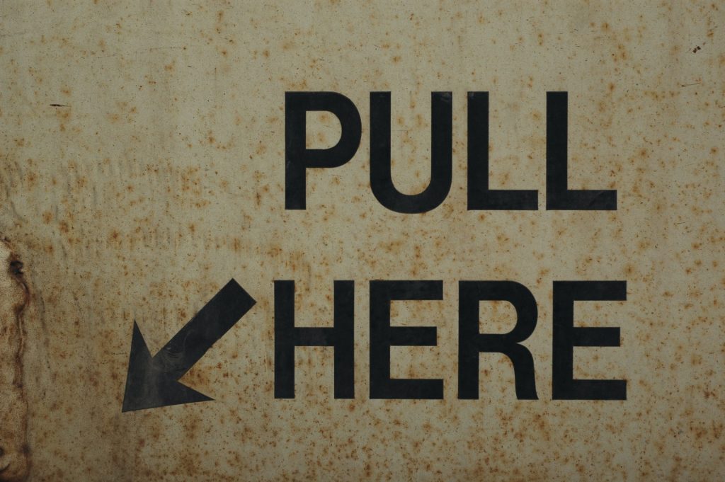 Pull here sign