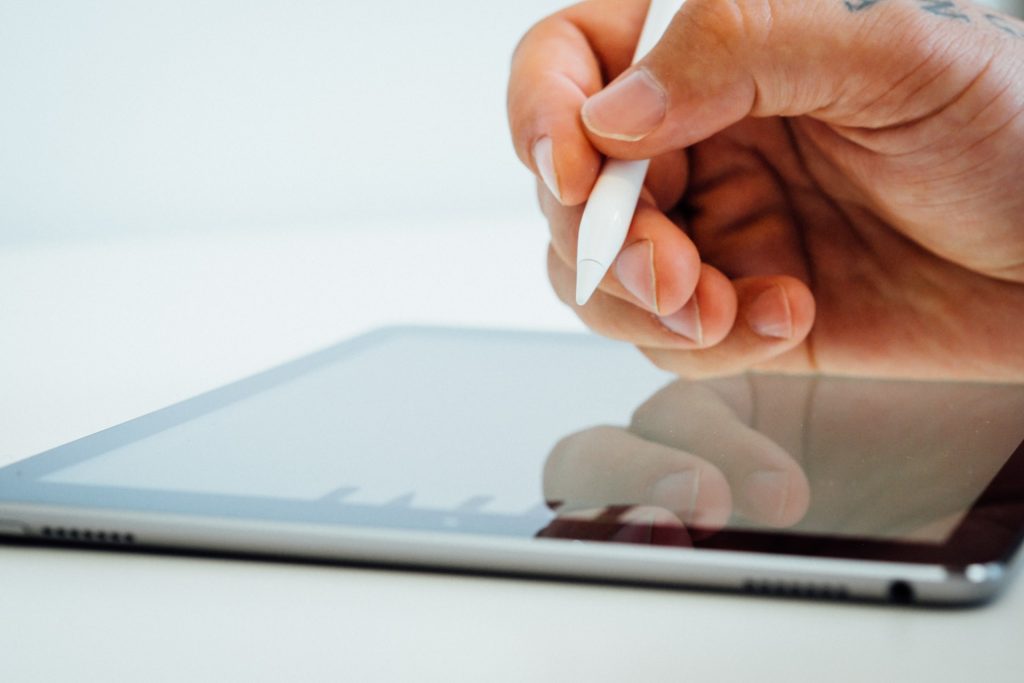 Person holding apple pencil